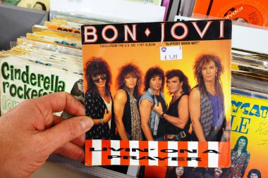 THE NETHERLANDS - JANUARY 2020: Single: Bon Jovi - Livin' on a PrayerSingle record of the American rock band Bon Jovi, in a second hand store. clipart