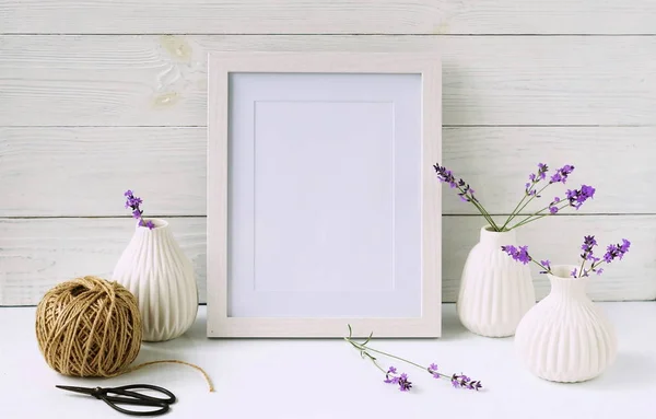 White frame mockup with lavender flowers in white vases. Copy space — Stock Photo, Image