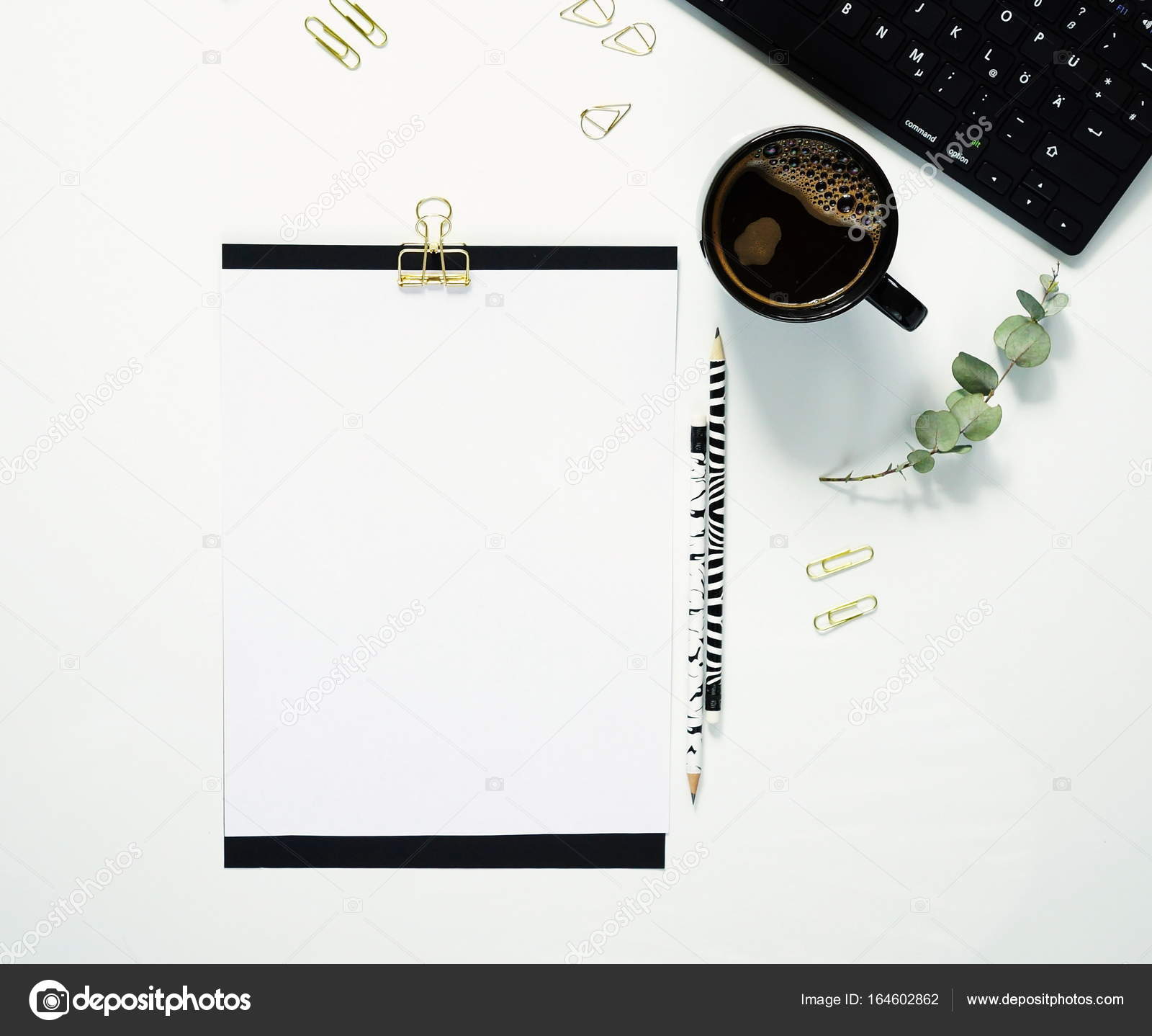 White Office Desk Table With Laptop Cup Of Coffee And Supplies