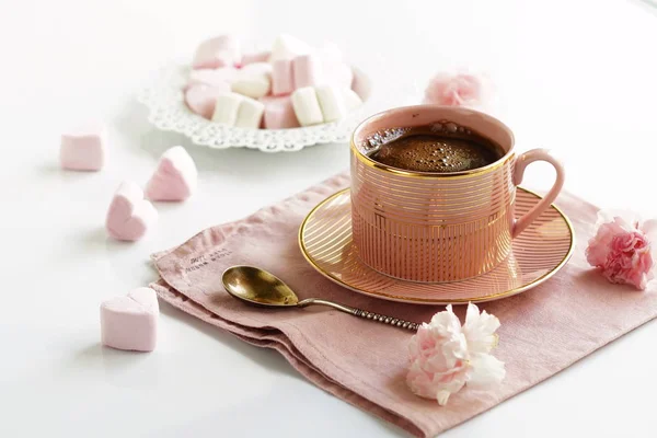 pink cup with coffee and marshmallows