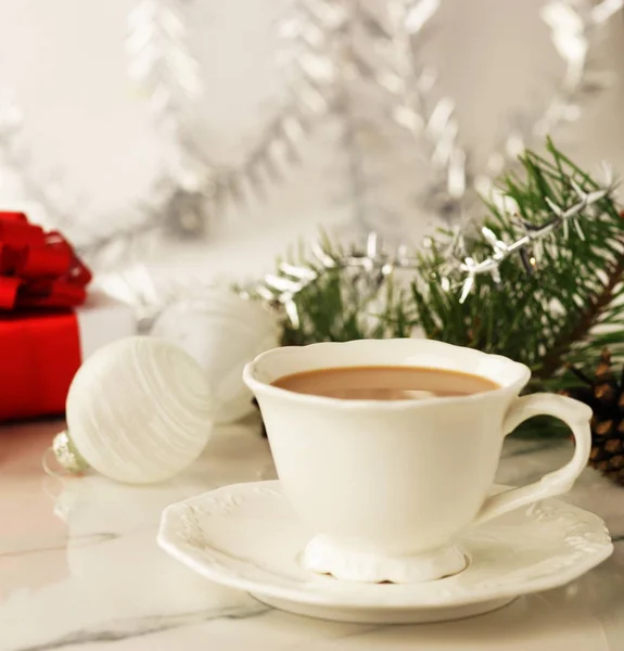 cup with cocoa and Christmas decorations