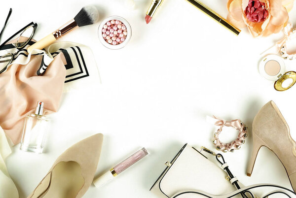 Female fashionable stylish accessories and make up cosmetics. Beige shoes with heels, bag, headscarf, glasses, lipstick, mascara, powder, brush, parfume on a white background. Copy space.Flat lay.top