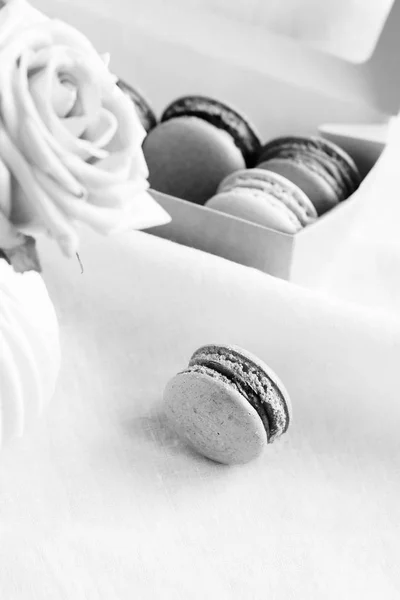 Macaroons with bouquet of roses. black and white