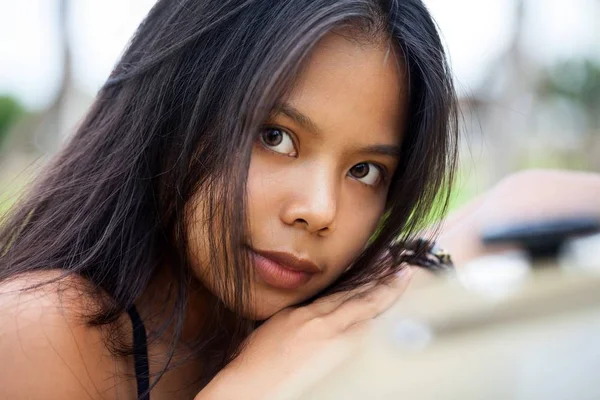 Young Asian woman close up shot.