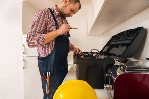 Handsome Guy Searching His Tool Kitchen — Stock Photo, Image