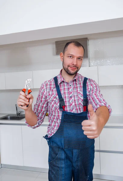 Adult Guy Uniform Pliers Standing Kitchen — Stock Photo, Image