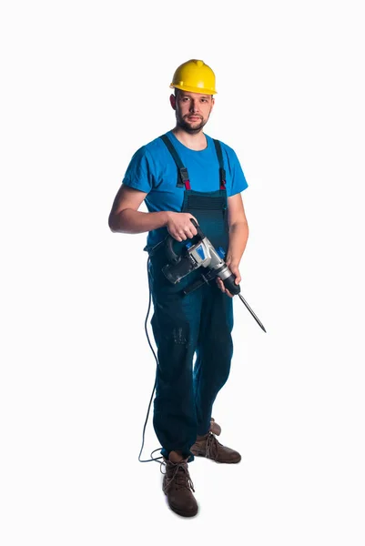 Handyman holding a drill on white background — Stock Photo, Image