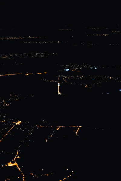 Night city view from an airplane window — Stock Photo, Image