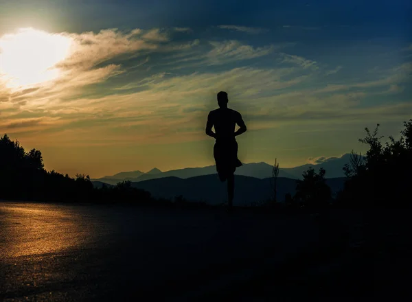 Ultra marathon trail silhouette runner with determination exercising for fitness and healthy lifestyle
