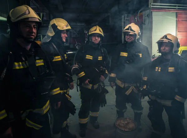 Team Firefighters Standing Indoors Buliding Next Fire Engine — Stock Photo, Image