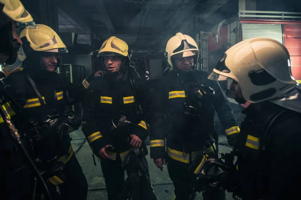 Team Firefighters Standing Indoors Buliding Next Fire Engine — Stock Photo, Image