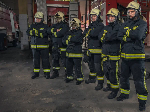 Group of firefighters standing confident with arms crossed. Fire — Stock Photo, Image