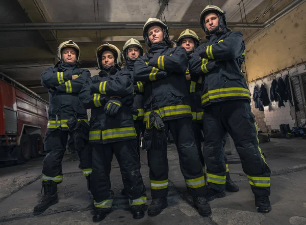 Group of firefighters standing confident with arms crossed. Fire — Stock Photo, Image