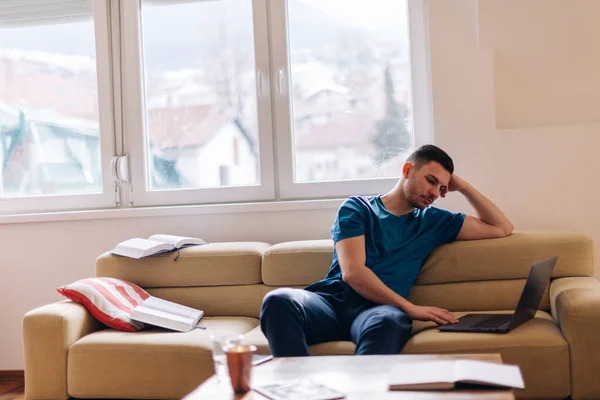 Handsome Student Studying Couch Few Opened Books Laptop Next Him — Stok fotoğraf
