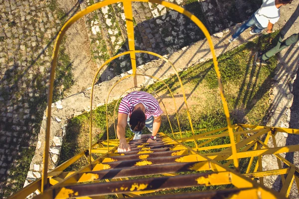 Man Climbing Metal Ladder Sunny Day Outdoors — Stock Photo, Image