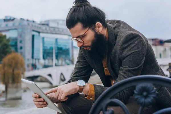 Stylish Hipster Wearing Classy Outfit Checking Mail Tablet — Stockfoto