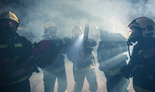 Group of firemen with gas masks standing in the middle of the ch — Stock Photo, Image