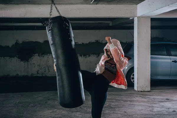 Young Sportswoman Doing High Kick Boxing Exercise Garage — Stock Photo, Image