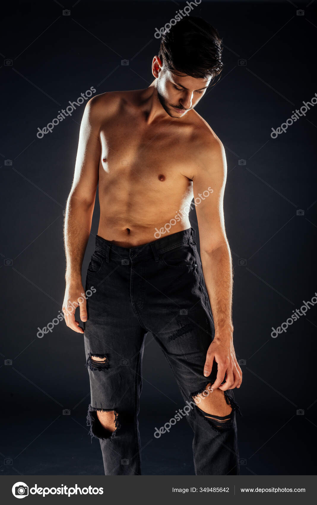 Cool Shirtless Guy Wearing Stylish Black Pants Sneakers Stock Photo by