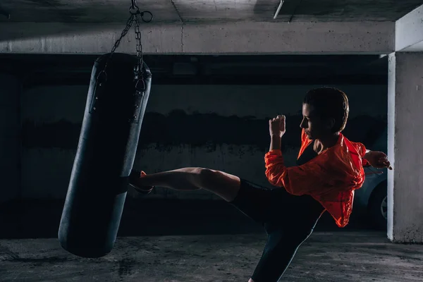 Young Silhouette Female Practicing High Kick Boxing Bag Garage — Stock Photo, Image