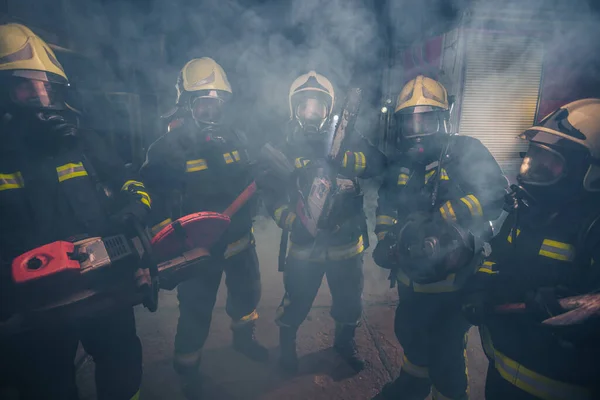 Group Firemen Gas Masks Standing Middle Chainsaw Smoke — Stock Photo, Image