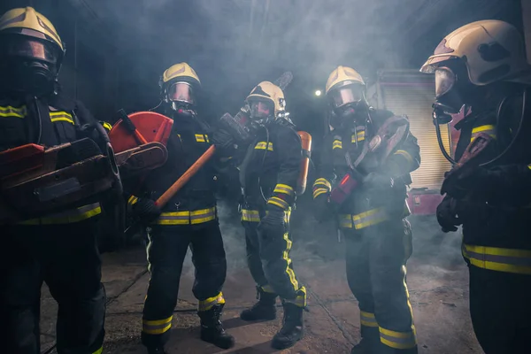 Group Firefighters Chainsaw Sledge Hammer Practicing Garage Fire Department — Stock Photo, Image