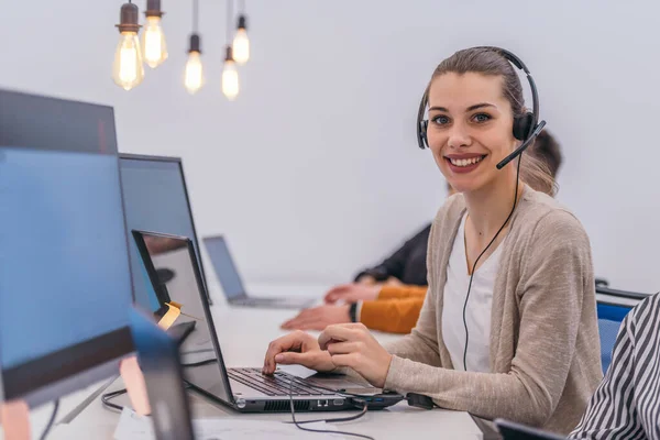 Attractive Businesswoman Headset Working Laptop Modern Coworking Space — Stock Photo, Image