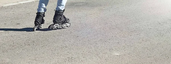 Roller skates and legs close-up in the Park Extreme sport.