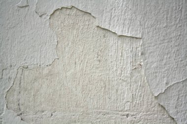 Aşınmış alçı, arka plan ve dokuları olan eski beyaz duvar..