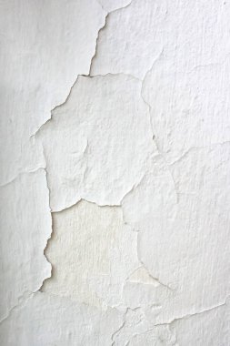 Aşınmış alçı, arka plan ve dokuları olan eski beyaz duvar..