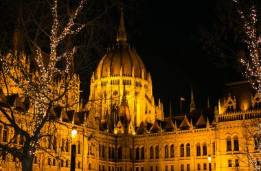 View of Hungarian Parliament building close view and Christmas bokeh lights at night