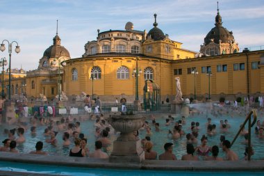 BUDAPEST, HUNGARY - JAUNARY 1, 2020: People relaxing at the Szechenyi thermal Baths of Budapest (built in 1913), the most visited and much praised attraction in the city, Hungary