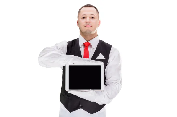 Guapo camarero joven en guantes y cravat rojo sosteniendo la tableta —  Fotos de Stock