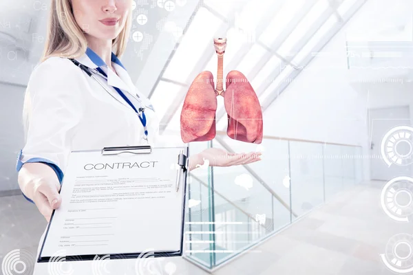 Double Exposure, Doctor holding human organs (lungs) and tablet, gray background . — стоковое фото