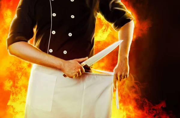 Cook with knife, front view with fire on background. 3D rendering and photo. High resolution. — Stock Photo, Image