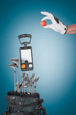 Professional golf equipment in studio on green & blue background clipart