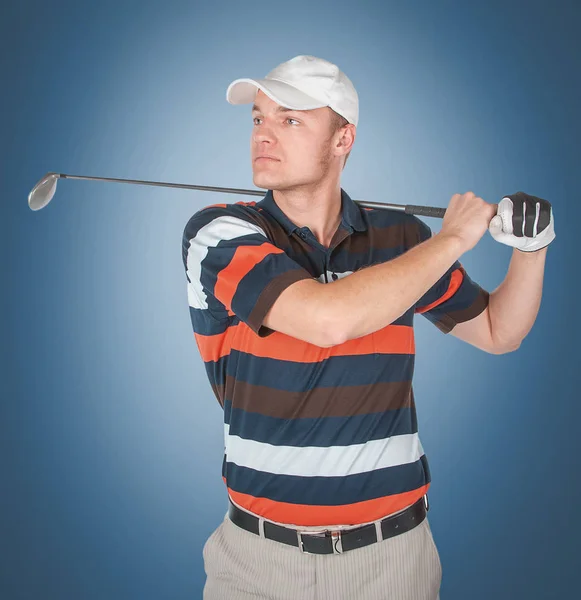 Emotionele knappe golfer speler pose in studio op blauw en gree — Stockfoto