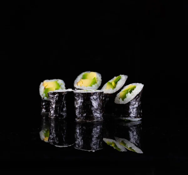 Japanese Sushi isolated on black background. Reflection in a mirror surface. Close up. Studio photo. — 图库照片