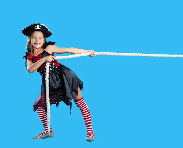 girl pirate pulls a rope on a blue background