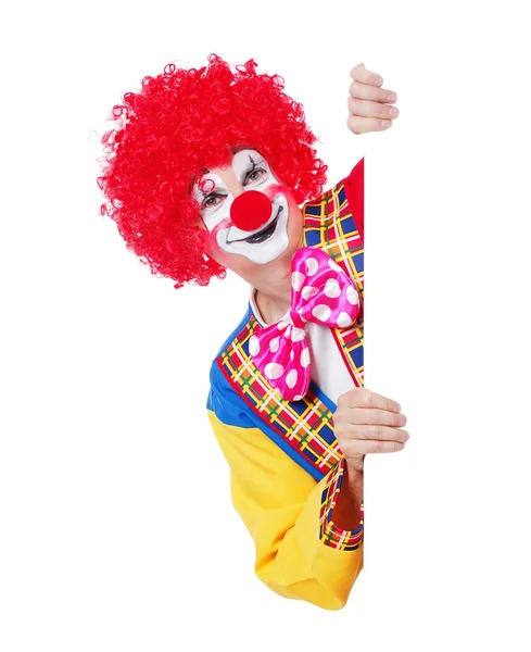 Happy clown holding blank board isolated on white background Royalty Free Stock Photos