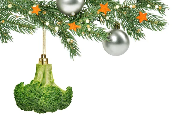 Christmas tree branch decorated with ornament in shape of brocco
