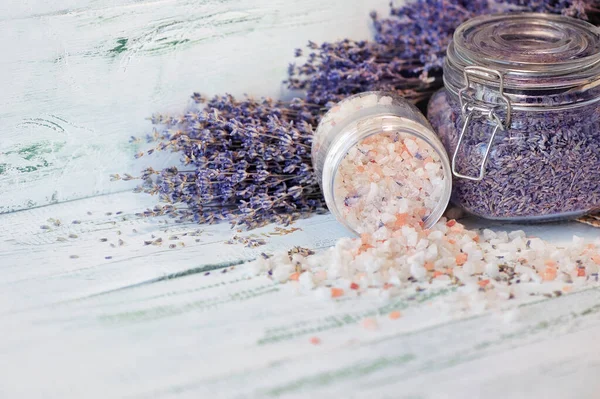 Close-up picture of SPA salt at lavender bouquets background