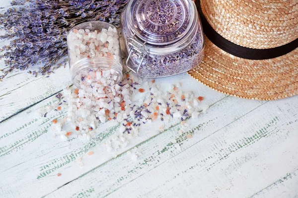 High key picture of lavender bouquets and straw hat