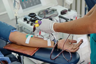 Almaty / Kazakhstan - 10.07.2019: Donor blood collection at the medical center clipart