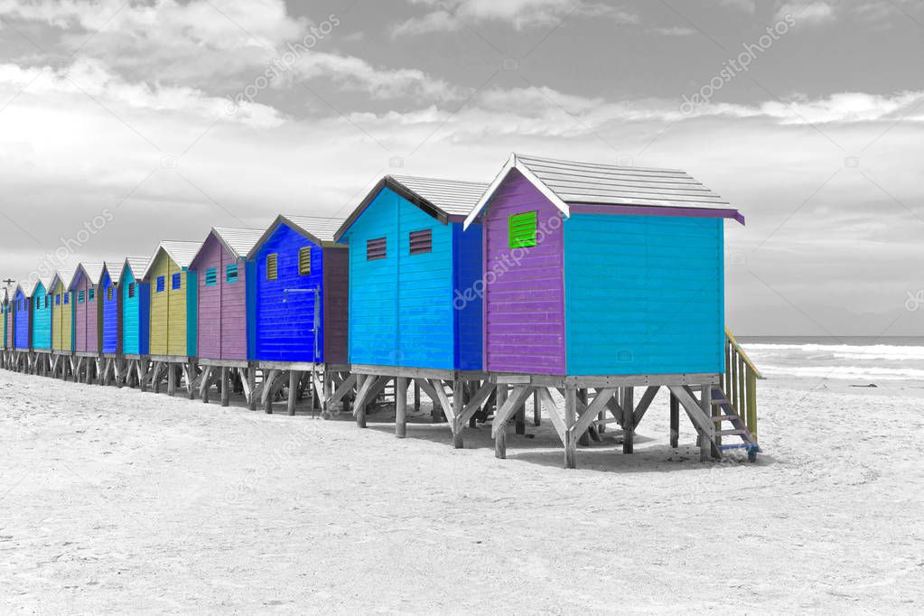 Blue and purple beach huts in South Africa