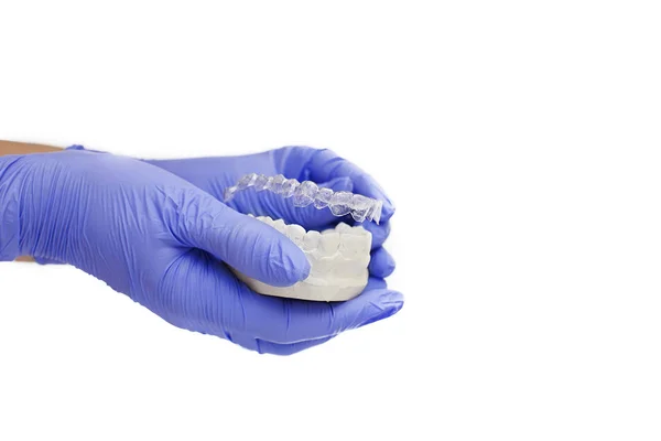 Close-up individual tooth tray Orthodontic dental theme. In hand Invisible braces — Stock Photo, Image