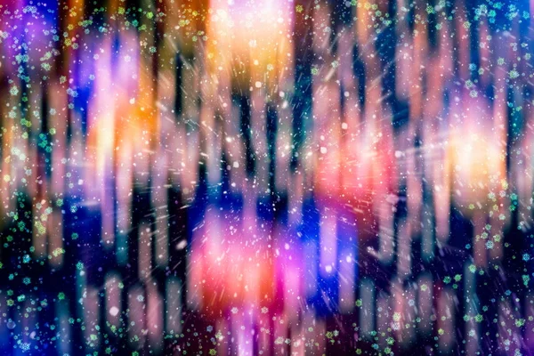 Blurred bokeh fondo de Navidad con copos de nieve. Fondo de Navidad abstracto con copos de nieve y estrellas —  Fotos de Stock