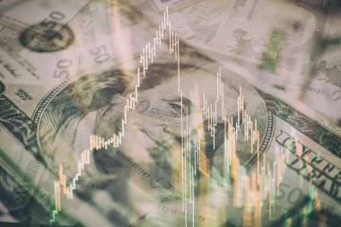 Borsa grafiği öndeki ekranda. Finans ve yatırım konsepti. Seçici odaklanma. Profesyonel teknik olarak hacim analizi de dahil olmak üzere çeşitli göstergelere sahip finansal araçların grafikleri 