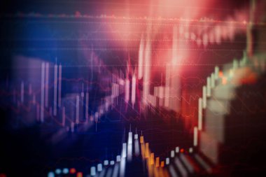 Borsa grafiği öndeki ekranda. Finans ve yatırım konsepti. Seçici odaklanma. Profesyonel teknik olarak hacim analizi de dahil olmak üzere çeşitli göstergelere sahip finansal araçların grafikleri 