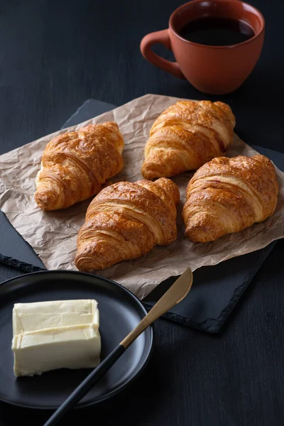 Fresh Croissants Coffee Butter Black Wooden Table — Stockfoto